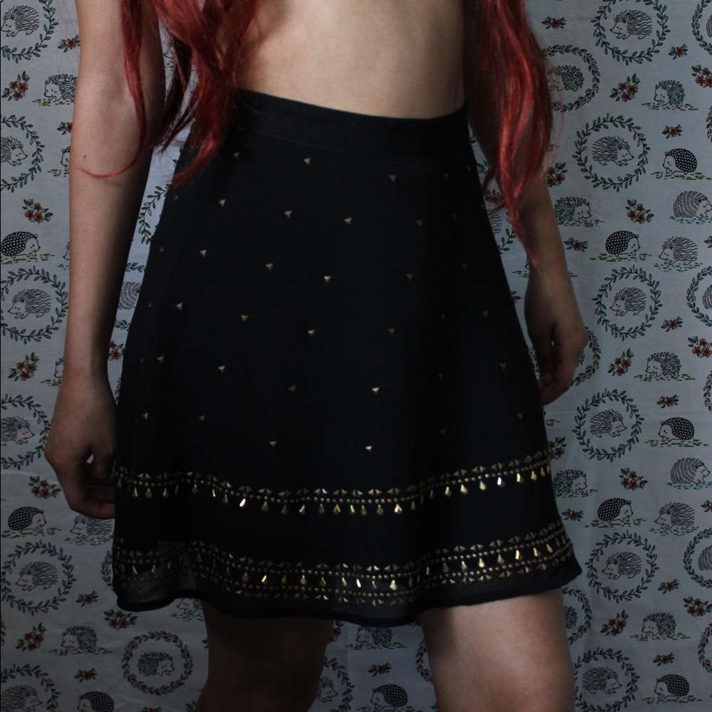 Ecote black skirt with gold embellishments.